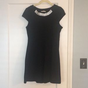 Black mini dress with rhinestone neck